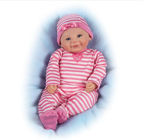 The Ashton-Drake Galleries RealTouch Vinyl Baby Doll, Pink Striped Outfit with Heart Design, Weighted Cloth Body, Blue Eyes